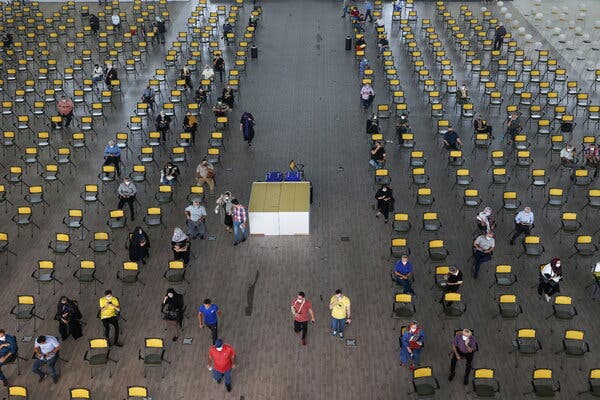 Iranians waiting to receive a coronavirus shot at a vaccination center in Tehran on Monday.